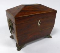 EARLY NINETEENTH CENTURY LINE INLAID ROSEWOOD TEA CADDY, of sarcophagus form with twin lidded