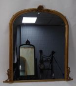 LARGE VICTORIAN STYLE MOULDED GILT GESSO OVERMANTLE MIRROR, the plate in an arch topped moulded