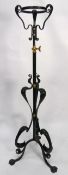 ART NOUVEAU BRASS AND BLACK PAINTED TELESCOPIC STANDARD LAMP, with whiplash scroll supports, 53? (