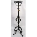 ART NOUVEAU BRASS AND BLACK PAINTED TELESCOPIC STANDARD LAMP, with whiplash scroll supports, 53? (