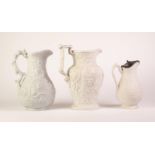 THREE WHITE GLAZED FOLIATE MOULDED POTTERY JUGS, comprising: A PROBABLY RIDGWAY & ABINGTON ?HARVEST?