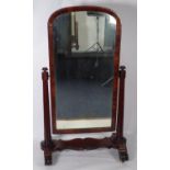 EARLY NINETEENTH CENTURY ROSEWOOD CHEVAL DRESSING MIRROR, the plate housed in an arch topped
