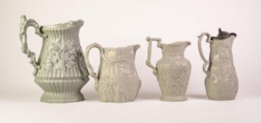 FOUR SAGE GREEN GLAZED FOLIATE MOULDED POTTERY JUGS, comprising THREE PROBABLY RIDGWAY & ABINGTON