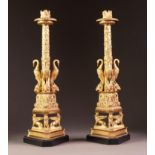 GOOD PAIR OF LATE NINETEENTH/ EARLY TWENTIETH CENTURY FRENCH GILT ORMOLU CANDLESTICKS, each modelled