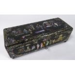 LATE NINETEENTH CENTURY BLACK LACQUERED AND MOTHER OF PEARL INLAID PAPIER MACHE GAMES BOX, of oblong