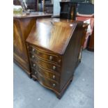 A SMALL REPRODUCTION MAHOGANY SERPENTINE FRONT BUREAU (BEVAN, FUNNELL)