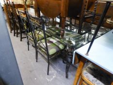 A WROUGHT IRON DINING TABLE, WITH GLASS TOP AND FOUR WROUGHT IRON DINING CHAIRS (5)