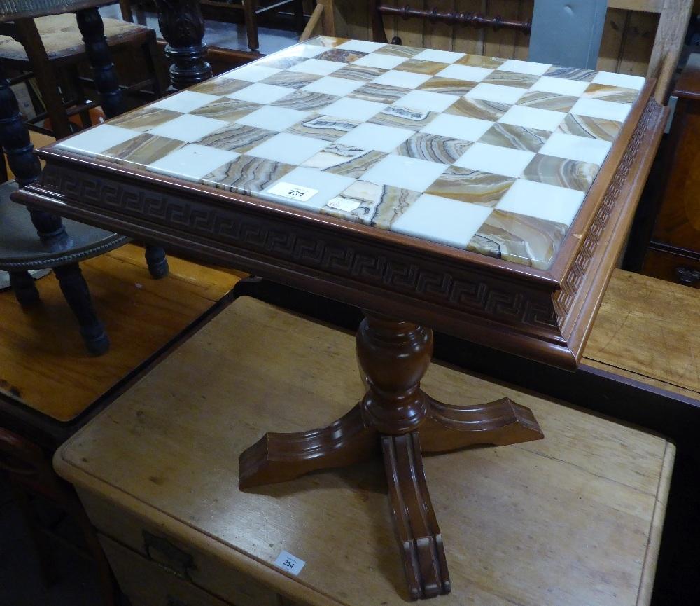 A MODERN OCCASIONAL TABLE WITH TOP SET FOR CHESS