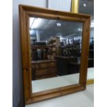 A PINE FRAMED WALL MIRROR