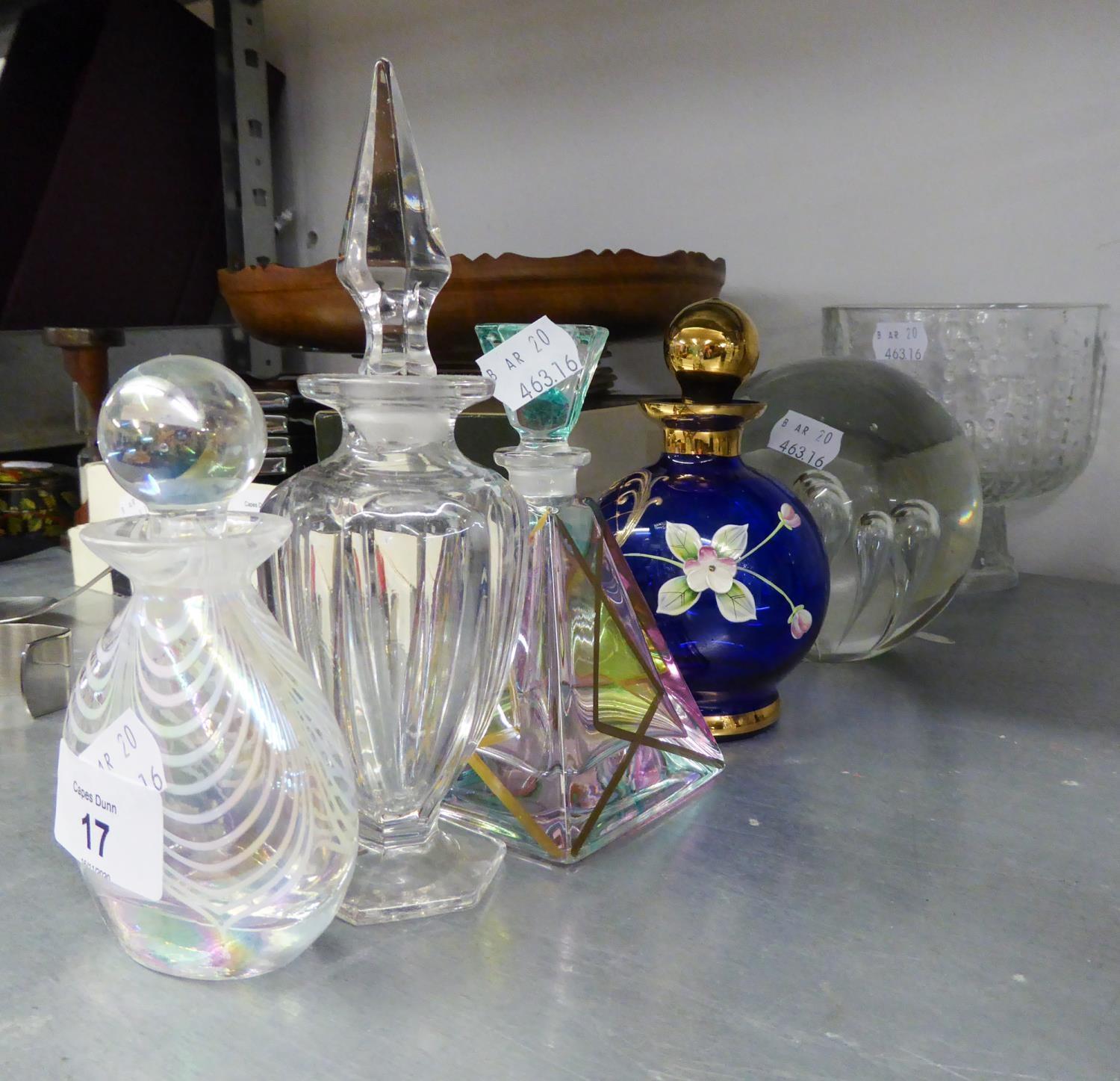 FOUR DECORATIVE GLASS PERFUME BOTTLES WITH ORNATE STOPPERS;  A ?PARLANE? LARGE GLASS GLOBULAR DOOR