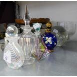 FOUR DECORATIVE GLASS PERFUME BOTTLES WITH ORNATE STOPPERS;  A ?PARLANE? LARGE GLASS GLOBULAR DOOR