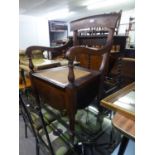 A MAHOGANY COMMODE WITH CANE SEAT AND FITTINGS