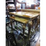 A NEST OF TWO GILT METAL AND MARBLE EFFECT COFFEE TABLES