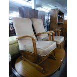 TWO WOOD FRAMED FIRESIDE ARMCHAIRS, COVERED IN PALE GOLD VELVET, ONE ROCKING ON SLEDGE FEET