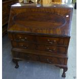 GOOD QUALITY MAHOGANY CARVED BUREAU, HAVING THREE LONG DRAWERS ON CABRIOLE CLAW AND BALL FEET WITH