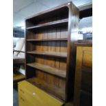 AN OPEN BOOKCASE WITH FOUR ADJUSTABLE SHELVES