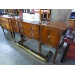 A REPRODUCTION MAHOGANY SERPENTINE FRONT SIDEBOARD (JAYCEE)