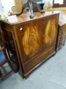 A REPRODUCTION MAHOGANY T.V. CABINET