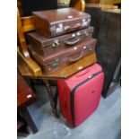 THREE GOOD QUALITY LEATHER BOUND SUITCASES, VARIOUS SIZES AND A LARGE MODERN SUITCASE (4)