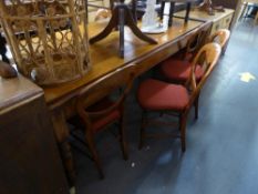 A SATIN WALNUT FARMHOUSE KITCHEN TABLE (190cm x 94cm) AND A SET OF 7 SINGLE DINING CHAIRS, WITH