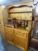 A MODERN PINE WELSH DRESSER WITH TWO TIER RAISED PLATE RACK