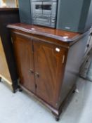 A REPRODUCTION MAHOGANY MEDIA CENTRE CABINET WITH FOLDING HINGE DOORS OVER FALL FRONT COMPARTMENT