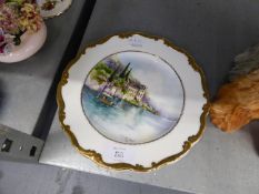 A CHINA PLAQUE, HAND PAINTED WITH AN ITALIAN LAKE SCENE, SIGNED AND DATED J.M. HALKHEAD 1996