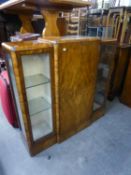 BURR WALNUT DISPLAY CABINET HAVING CENTRAL CUPBOARD DOOR BETWEEN ETCHED GLASS FRONTED DOOR