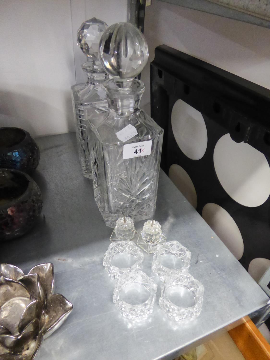 TWO GLASS DECANTERS AND TWO GLASS PRICKED CANDLE HOLDERS, FOUR GLASS NAPKIN HOLDERS (8)