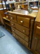 A PINE CHEST OF TWO SHORT AND THREE LONG DRAWERS