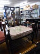 A BEECHWOOD LOW SEATED OPEN ARMCHAIR, WITH CANE SEAT AND SQUAB CUSHIONS