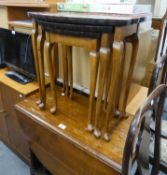 A NEST OF THREE WALNUT COFFEE TABLES