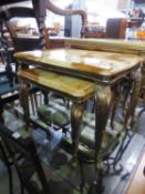 A NEST OF TWO GILT METAL AND MARBLE EFFECT COFFEE TABLES