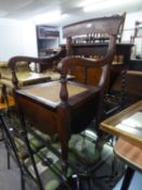 A MAHOGANY COMMODE WITH CANE SEAT AND FITTINGS