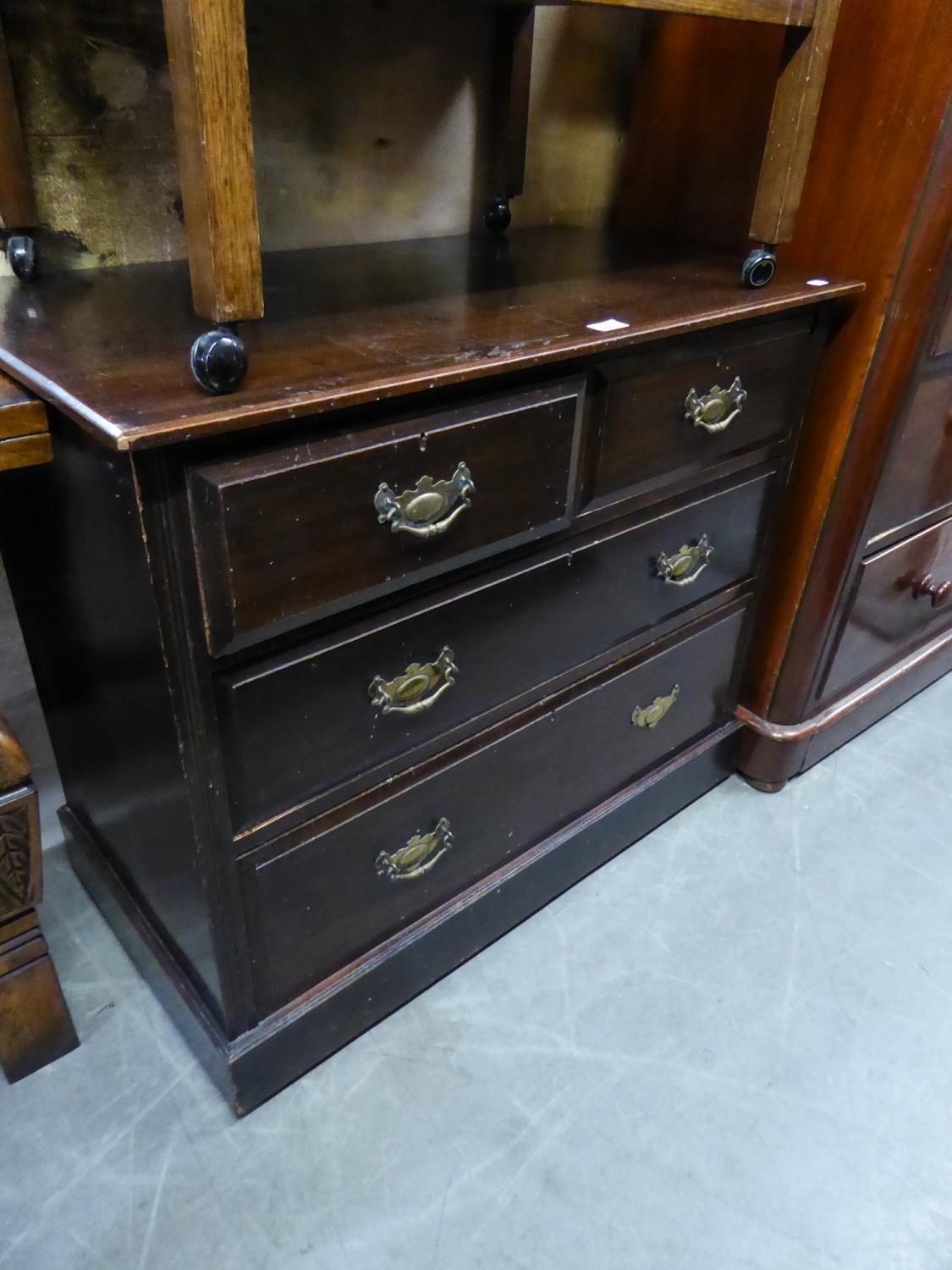 A STAINED WOOD CHEST OF TWO SHORT AND TWO LONG DRAWERS