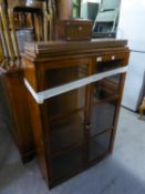 A BOOKCASE WITH THREE ADJUSTABLE SHELVES AND TWO GLAZED DOORS AND AN ANTIQUE TEA CADDY (A.F.) (2)