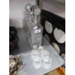TWO GLASS DECANTERS AND TWO GLASS PRICKED CANDLE HOLDERS, FOUR GLASS NAPKIN HOLDERS (8)