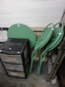 A GREEN METAL CIRCULAR FOLDING GARDEN TABLE AND A PAIR OF MATCHING CHAIRS WITH METAL CIRCULAR SEATS