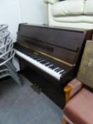 A MODERN KEMBLE UPRIGHT PIANO, IN MAHOGANY FRAME