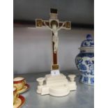 A BAKELITE DEVOTIONAL CRUCIFIX WITH STOOP AND CANDLE HOLDERS, 14 3/4" (37.5cm) high