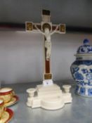 A BAKELITE DEVOTIONAL CRUCIFIX WITH STOOP AND CANDLE HOLDERS, 14 3/4" (37.5cm) high