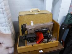 AN ELECTRIC PORTABLE SEWING MACHINE