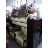 A LOUNGE SUITE OF THREE PIECES COVERED IN CREAM HIDE (ONE CHAIR RECLINING)