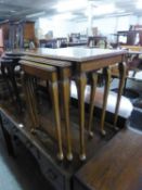 A NEST OF THREE FIGURED WALNUT OBLONG COFFEE TABLES