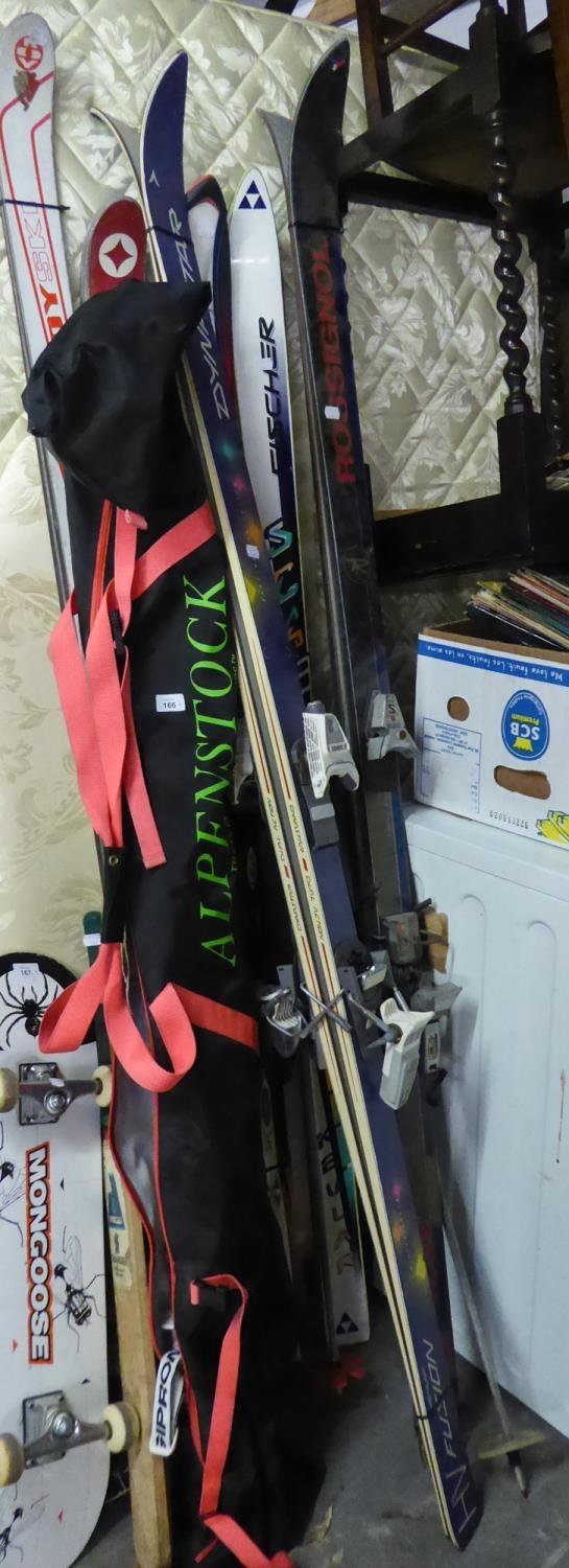 SEVEN PAIRS OF SKIS AND A SKI BAG