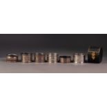 FIVE VICTORIAN AND LATER SILVER NAPKIN RINGS, including, a CASED EXAMPLE, scroll engraved,