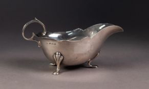 EDWARD VII SILVER SAUCE BOAT, of typical form with flying scroll handle, shaped border and pad feet,