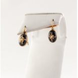 PAIR OF VICTORIAN GOLD MOURNING EARRINGS set with cabochon black onyx with gold star overlay, set