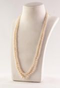TWO STRAND NECKLACE OF GRADUATED CULTURED PEARLS, 19in (48.2cm) long, with gold safety chain