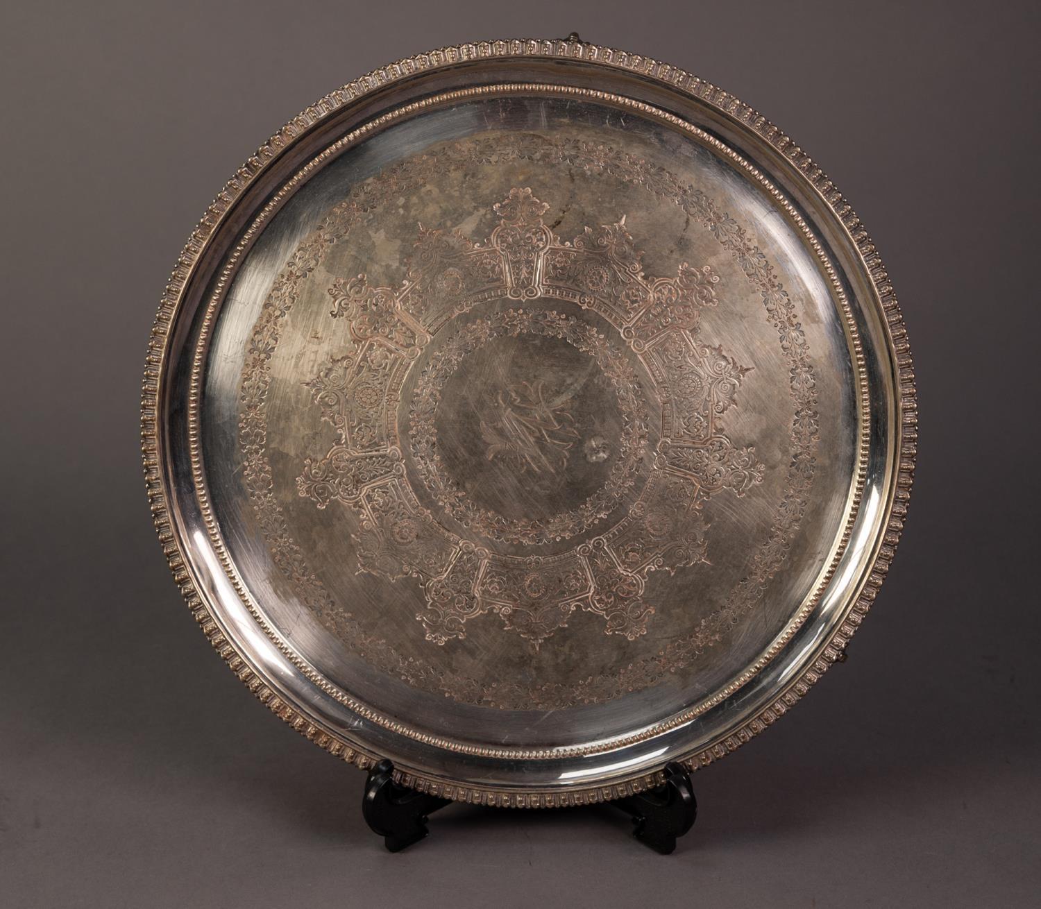 VICTORIAN ELECTROPLATED SALVER, of circular form with engraved centre and claw and ball feet,